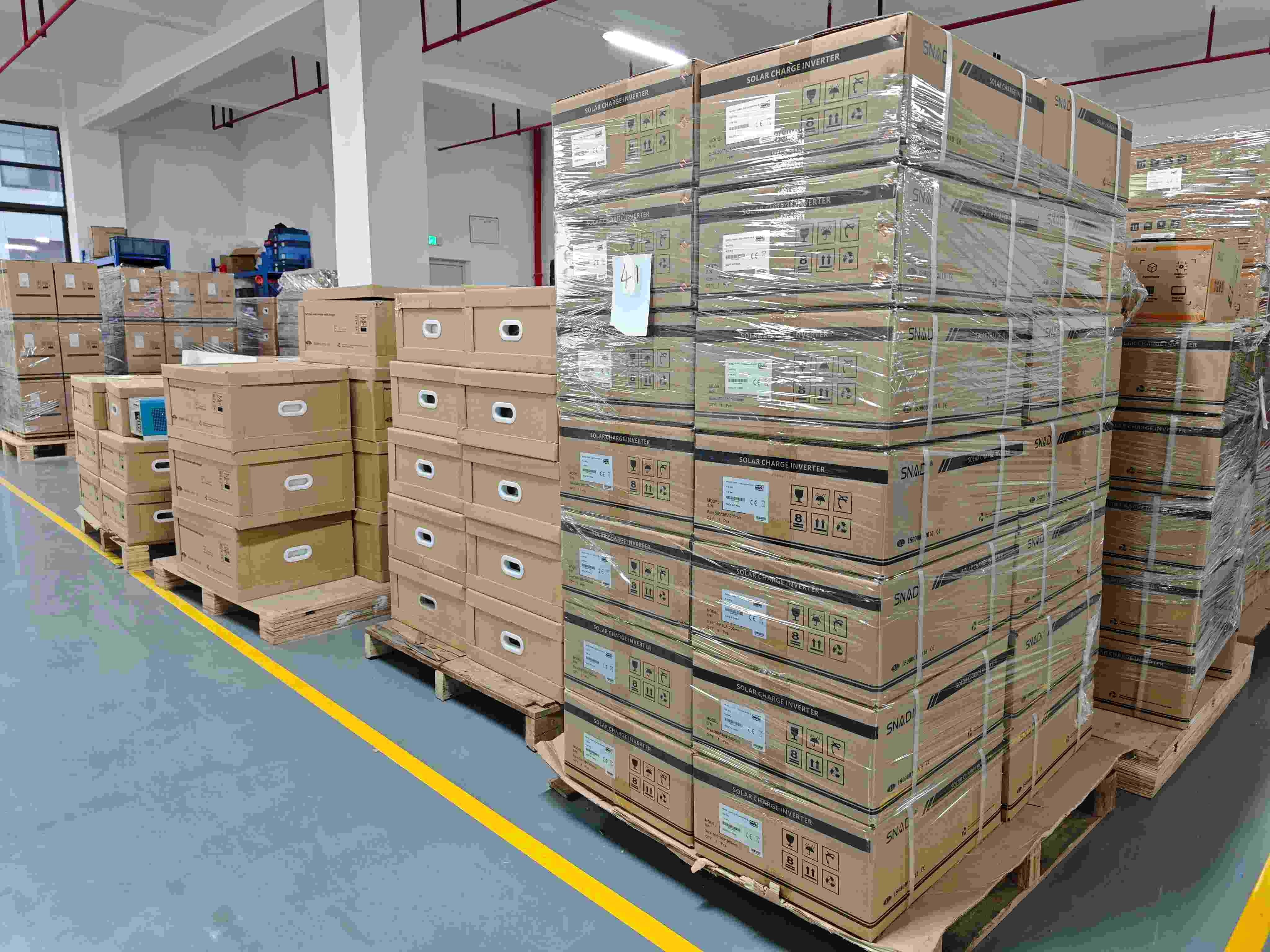 Solar Inverter OQC, Warehousing and Shipment Packaged solar inverters prepared for final outgoing quality inspection and bulk shipment from the SNAT Solar warehouse.