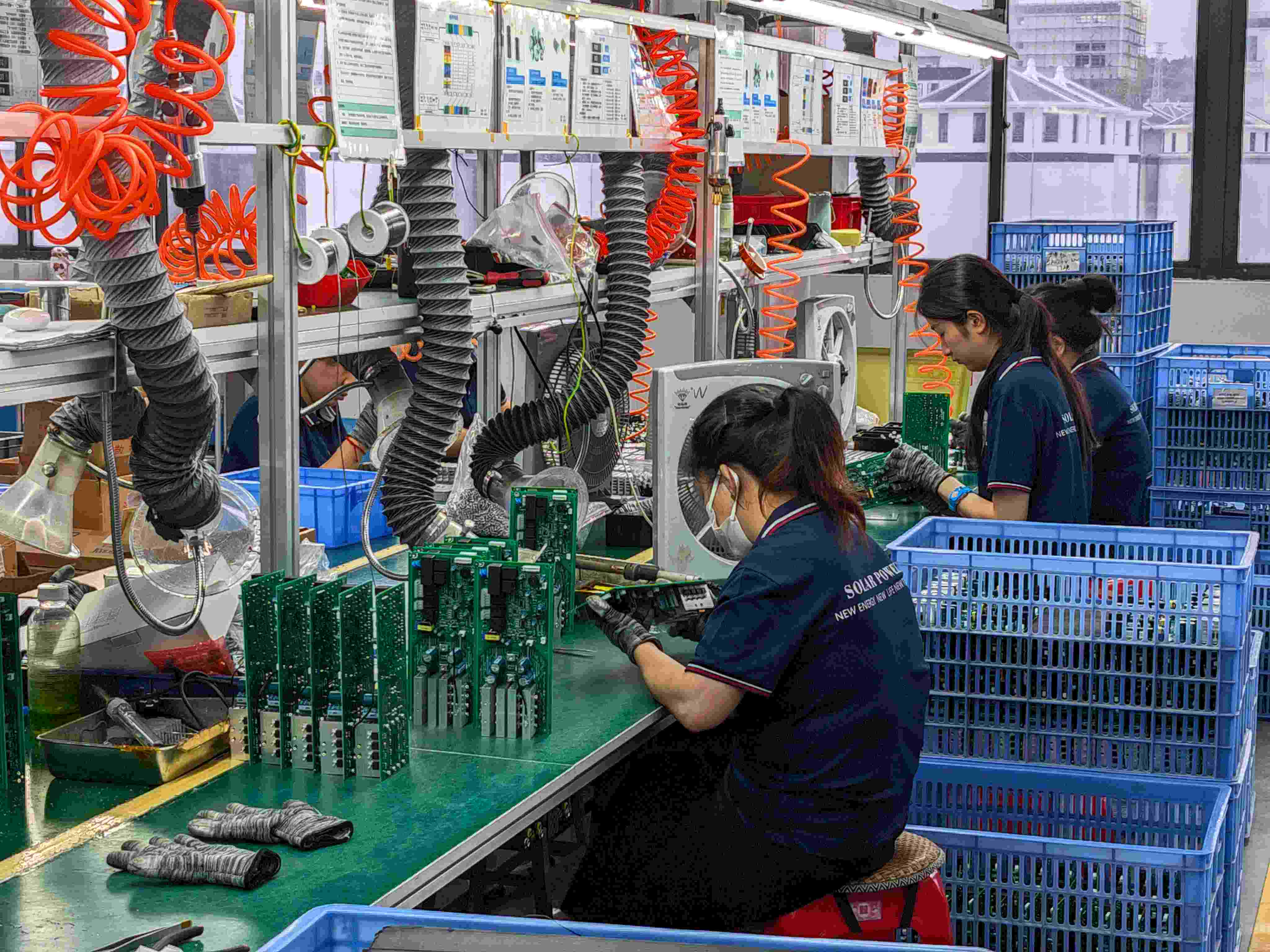 Solar Inverter Engineering and Electrical Testing SNAT Solar engineer conducting electrical performance testing on inverter components with professional test equipment.