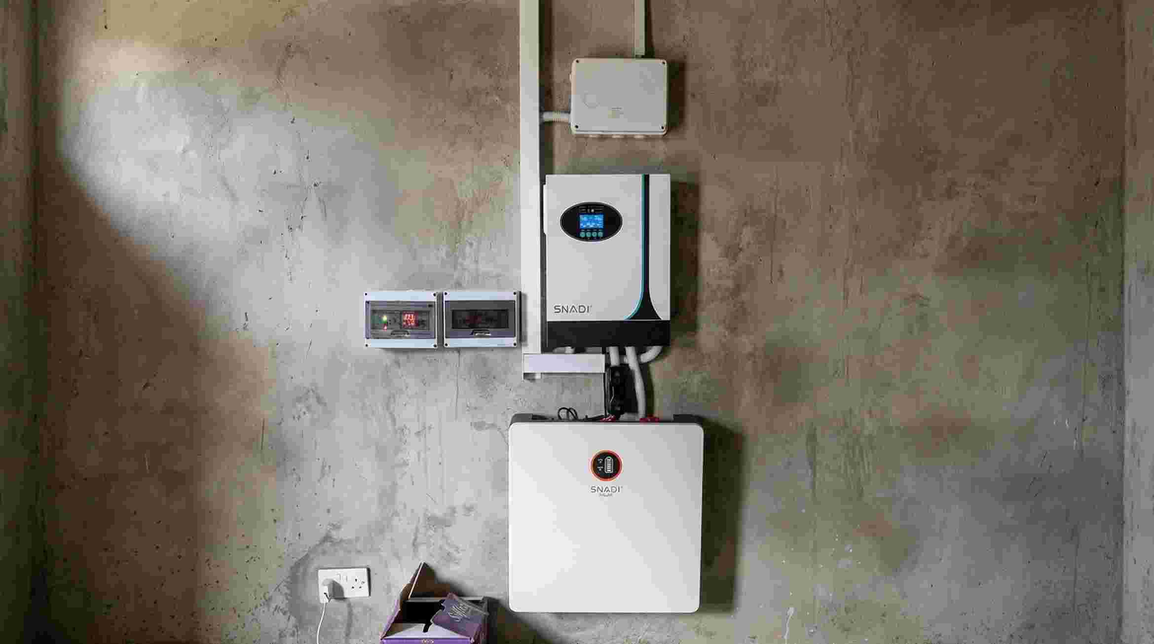 Professional installation of SNADI hybrid solar inverters and lithium battery energy storage system for home power backup.