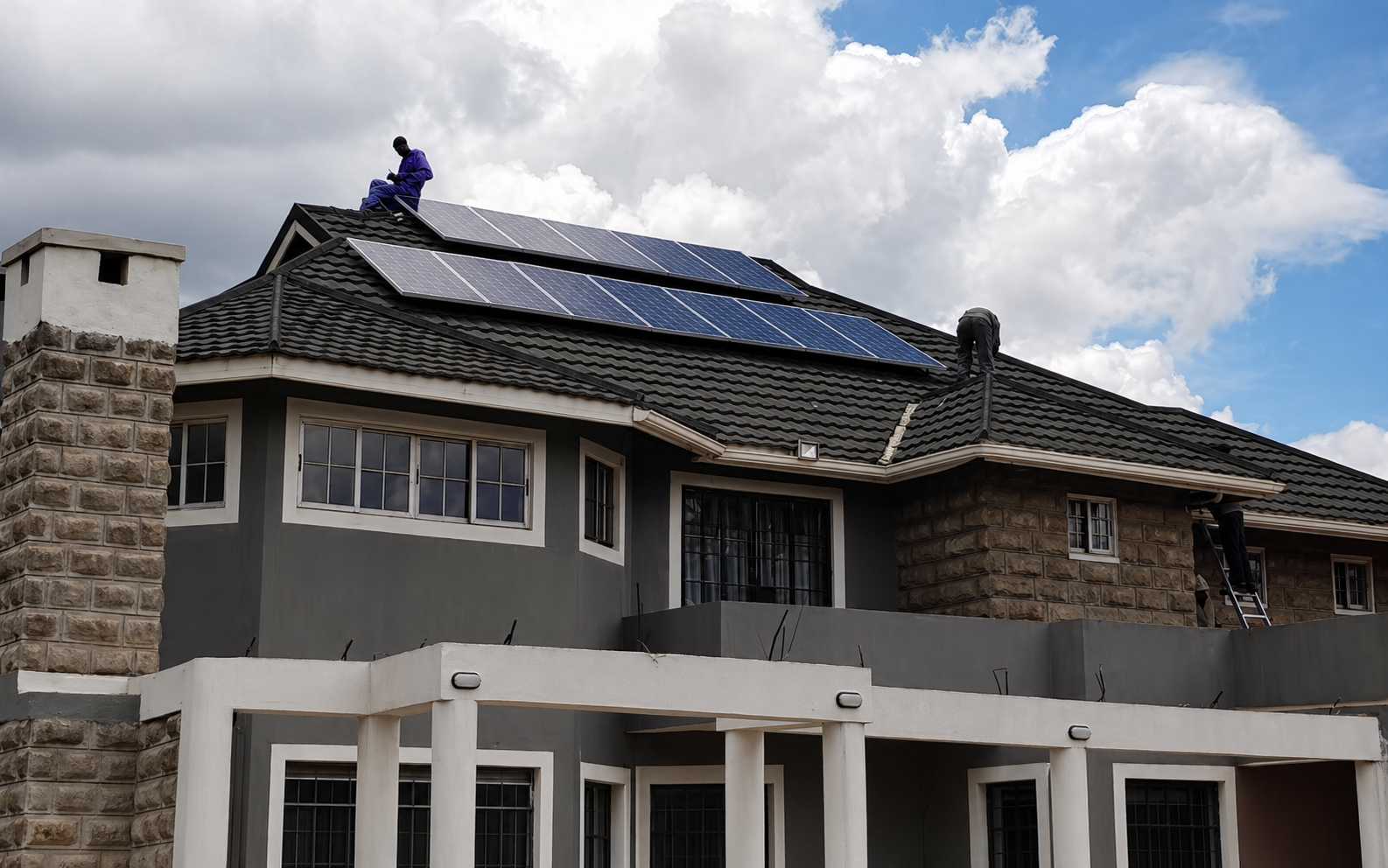 Residential rooftop solar panel installation by SNADI for sustainable off-grid living solutions.