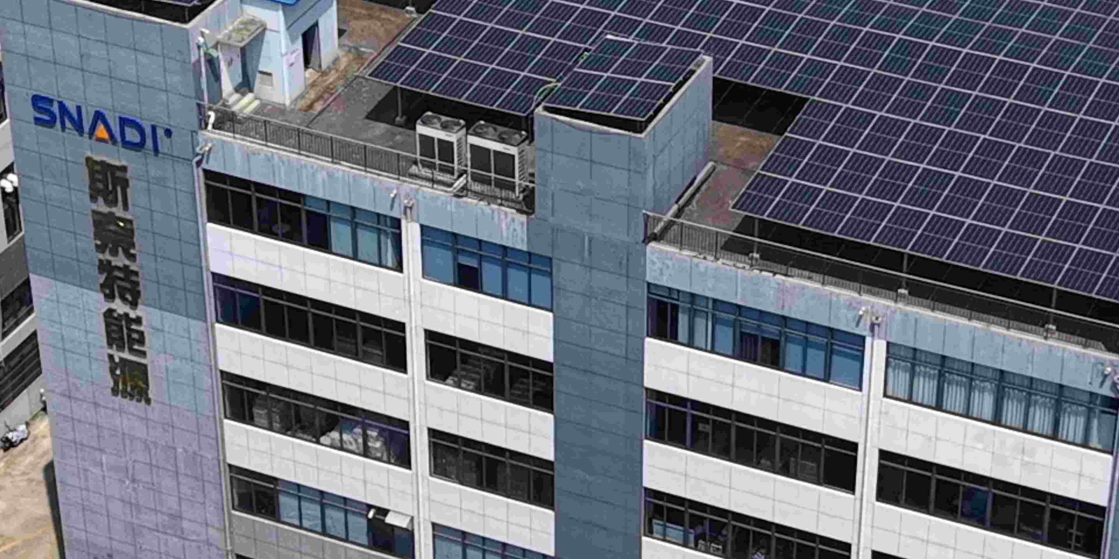 SNADI solar inverter factory and R&D headquarters featuring a large-scale rooftop PV system, showcasing our manufacturing capacity for custom energy storage solutions.